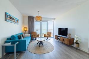 Vakantiewoning aan het strand - tuin en terras met haven- & zeez