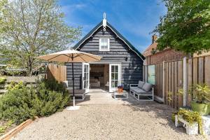 Vakantiewoning Vrouwenpolder | lichte moderne woning met grote t